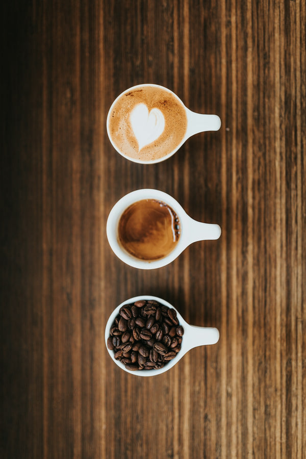 Three white ceramic mugs