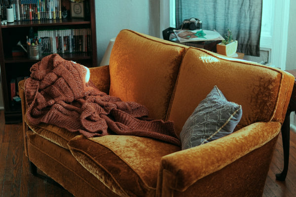 Blanket and pillow on a sofa