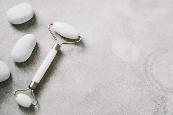 White facial massage roller