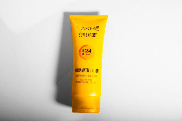 Sunscreen tube on a white surface